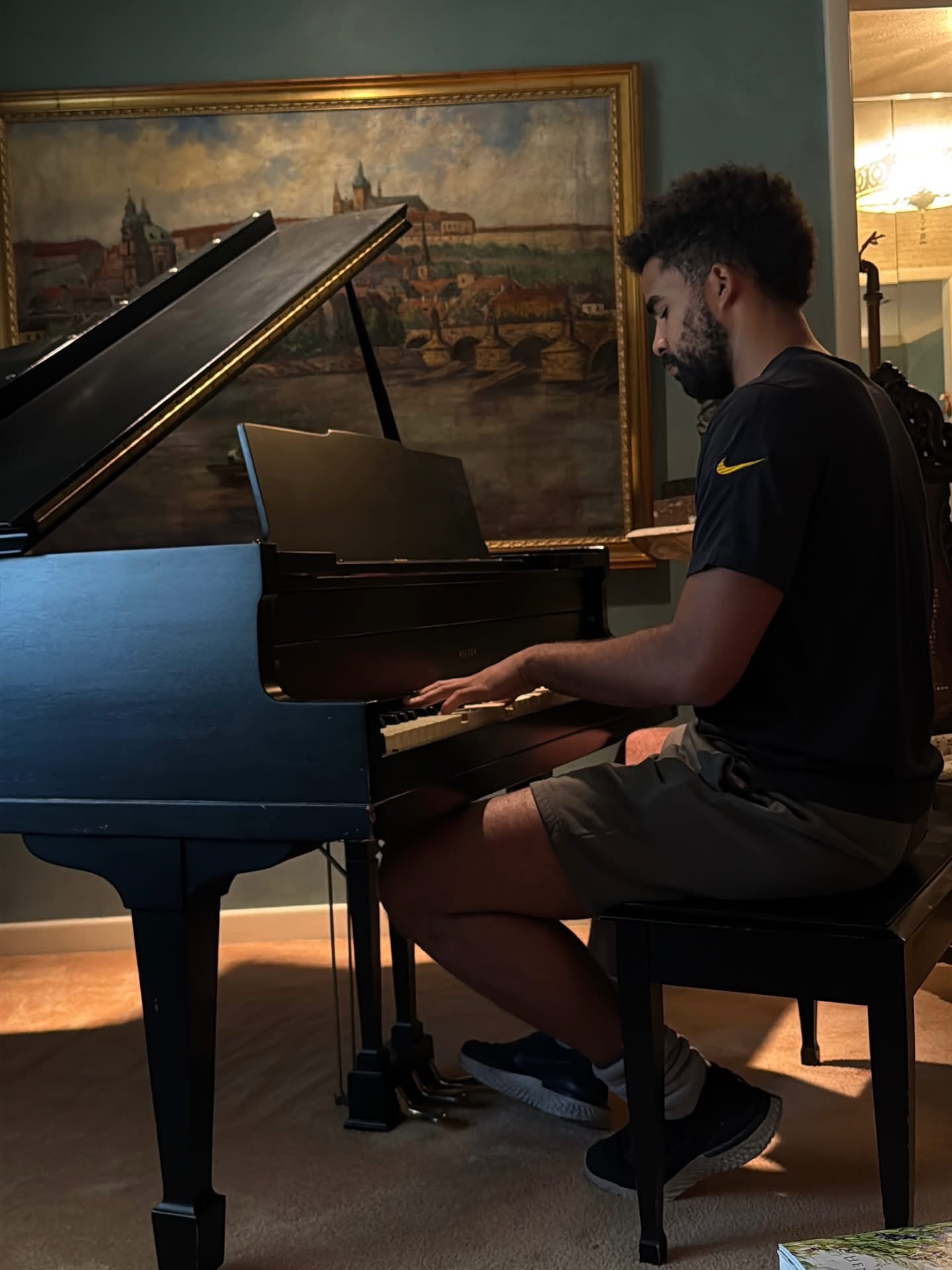 Man playing a grand piano